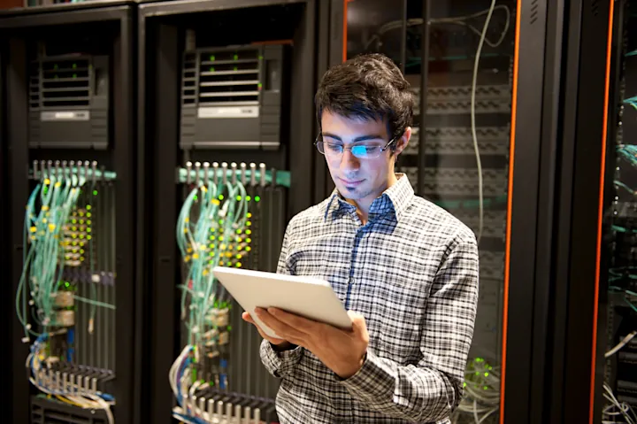 IT technician managing server infrastructure and network
