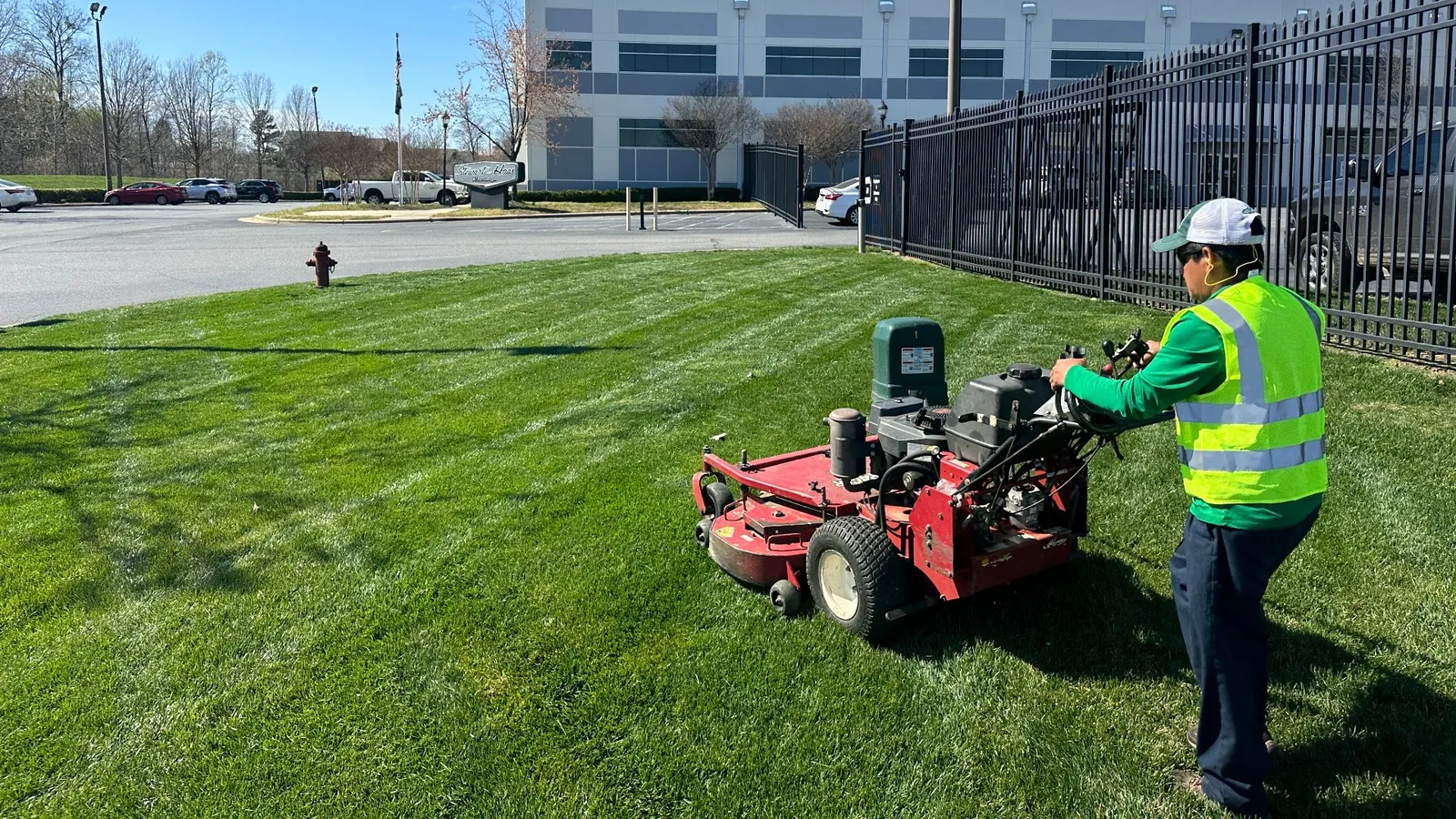 Commercial landscaping crew mowing a lawn