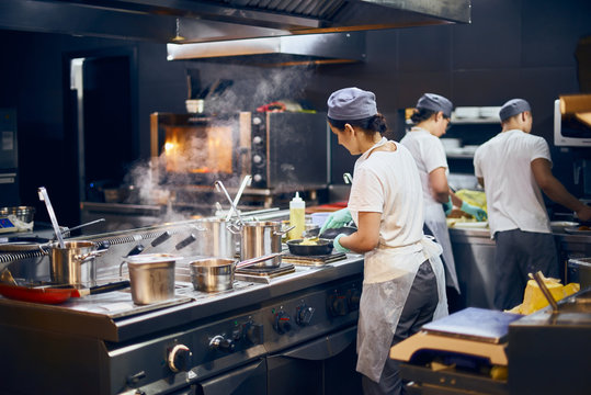 Busy commercial kitchen with chefs